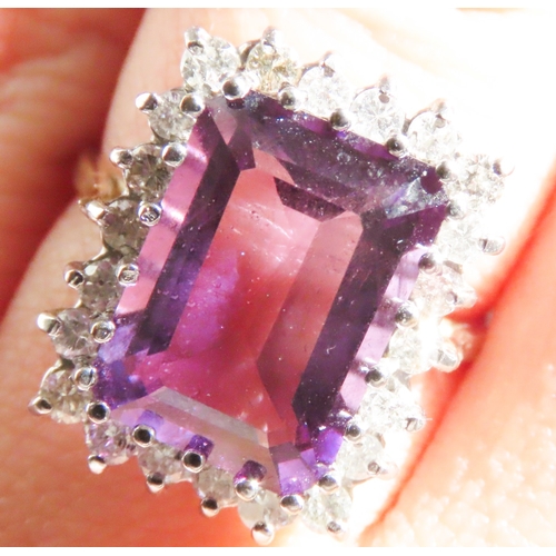 70 - Emerald Cut Amethyst Centre Stone Ring with Diamond Set Halo Surround Mounted in 9 Carat Yellow Gold... 