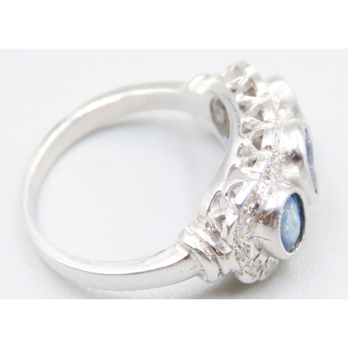 71 - Three Stone Sapphire and Tanzanite Set Ring with Diamond Cluster Surround Mounted in 9 Carat White G... 