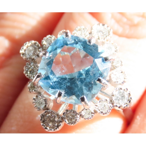 73 - Cushion Cut Sky Blue Topaz Centre Stone Ring with Diamond Set Halo Surround Mounted in 9 Carat White... 