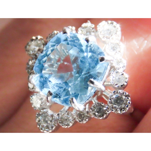 73 - Cushion Cut Sky Blue Topaz Centre Stone Ring with Diamond Set Halo Surround Mounted in 9 Carat White... 