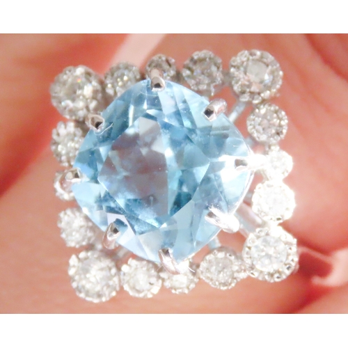 73 - Cushion Cut Sky Blue Topaz Centre Stone Ring with Diamond Set Halo Surround Mounted in 9 Carat White... 