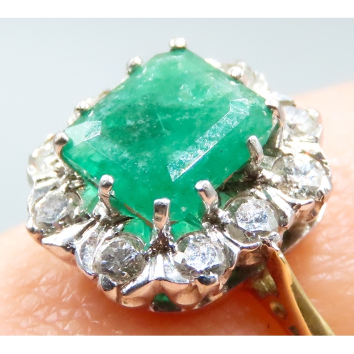 93 - 1950's Emerald Centre Stone Ring with Ten Diamond Set Surround Mounted in 18 Carat Yellow Gold Total... 