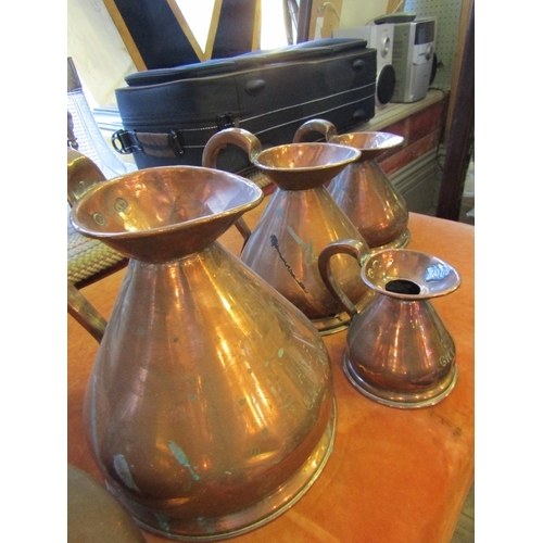 1040 - Set of Five Copper Measuring Jugs Graduated Sizes