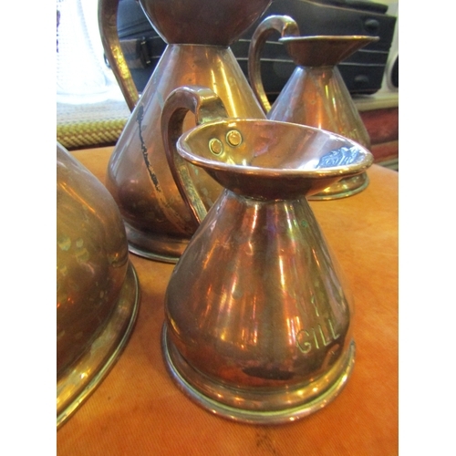 1040 - Set of Five Copper Measuring Jugs Graduated Sizes