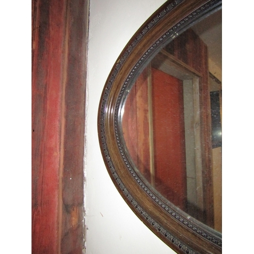 1101 - Edwardian Walnut Oval Mirror Approximately 36 Inches Wide