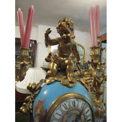 1107 - French Three Piece Clock Suite with Upper Cherub Motif Decoration Porcelain Inset Includes Two Rocco... 