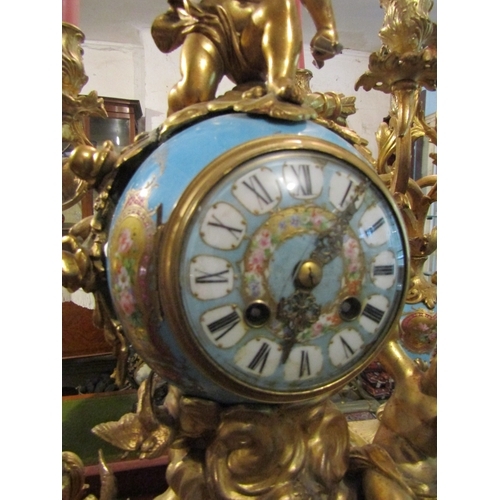 1107 - French Three Piece Clock Suite with Upper Cherub Motif Decoration Porcelain Inset Includes Two Rocco... 