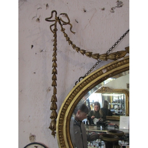 1351 - Antique Adams Form Gilded Oval Mirror with Upper Urn and Swag Motif Decoration Approximately 40 Inch... 