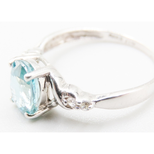 141 - Blue Topaz Set Ring with Gemstones Set to Shoulders Mounted in 10 Carat White Gold Ring Size O