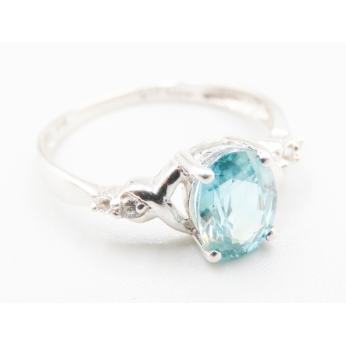 141 - Blue Topaz Set Ring with Gemstones Set to Shoulders Mounted in 10 Carat White Gold Ring Size O