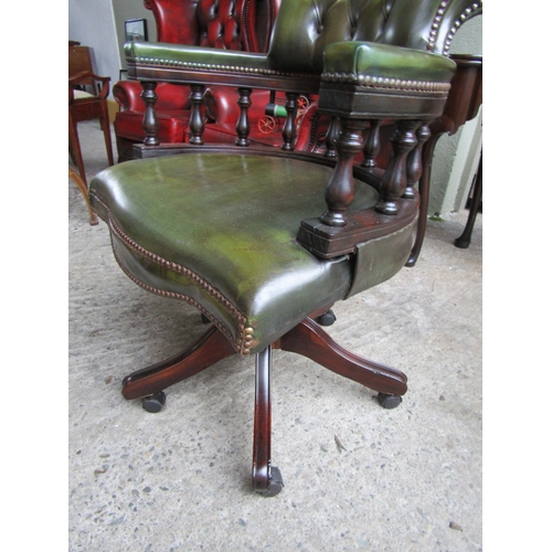 1530 - Green Leather Deep Buttoned Upholstered Captain's Office Armchair Rail form Supports Above Swivel Ba... 