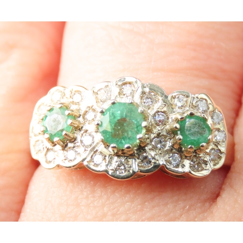 156 - Emerald Three Stone Set Ring with Diamond Set Surround Mounted in 9 Carat Yellow Gold Ring Size P