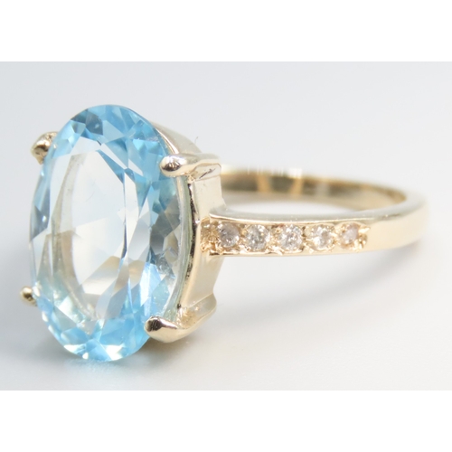 157 - Oval Cut Blue Topaz Set Ring Mounted in 9 Carat Yellow Gold Diamonds set to Shoulders Mounted in 9 C... 