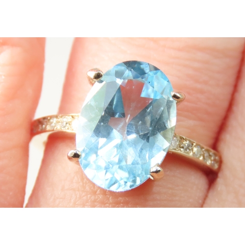 157 - Oval Cut Blue Topaz Set Ring Mounted in 9 Carat Yellow Gold Diamonds set to Shoulders Mounted in 9 C... 