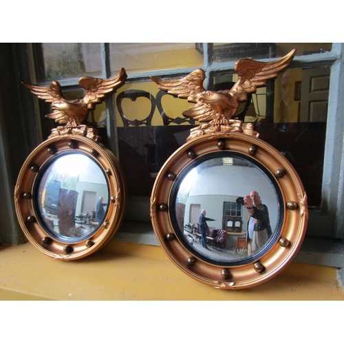 1581 - Pair of Gilded Convex Mirrors Eagle Motif Surmounts Each Mirror Approximately 12 Inches Diameter