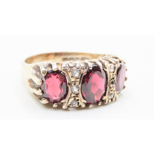 168 - Red Garnet Three Stone Ring Mounted in 9 Carat Yellow Gold Gemstone Insets Ring Size N