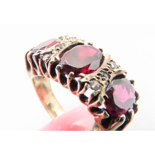 168 - Red Garnet Three Stone Ring Mounted in 9 Carat Yellow Gold Gemstone Insets Ring Size N