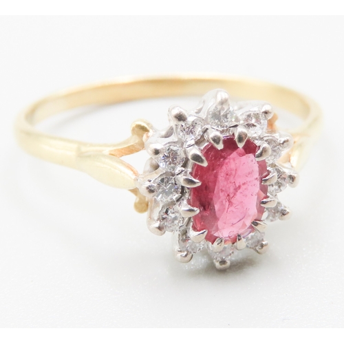 175 - Ruby Centre Stone Ring with Diamond Set Halo Surround Mounted in 18 Carat Yellow Gold Ring Size V