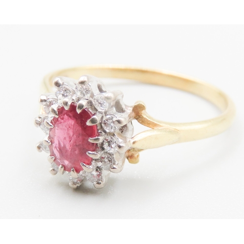 175 - Ruby Centre Stone Ring with Diamond Set Halo Surround Mounted in 18 Carat Yellow Gold Ring Size V