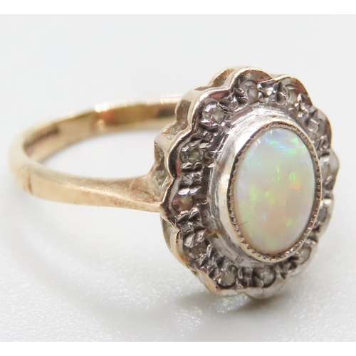 197 - Attractively Detailed Opal Bezel Set Centre Stone Ring with Diamond Set Halo Mounted in 9 Carat Yell... 