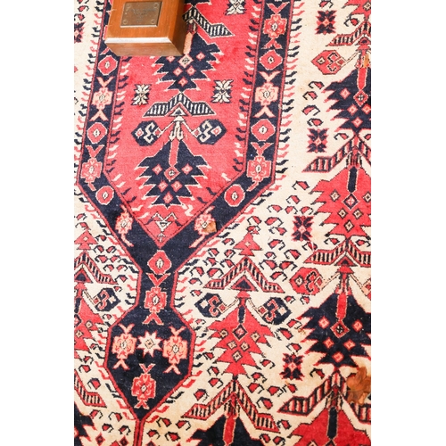 1988 - A Persian Pure Wool Rug Patterned Borders Approximately 5ft 6 Inches Long x 3ft 6 Inches Wide