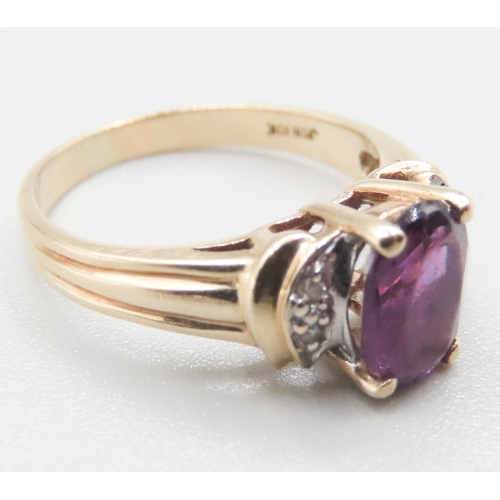 200 - Amethyst Set Ring Mounted in 10 Carat Yellow Gold with Diamonds Set to Shoulders Ring Size J