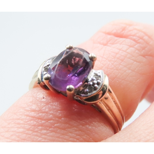 200 - Amethyst Set Ring Mounted in 10 Carat Yellow Gold with Diamonds Set to Shoulders Ring Size J