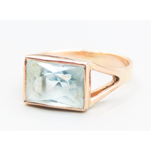 21 - Single Stone Aquamarine Bezel Set Ring Mounted in 9 Carat Rose Gold Ring Size O