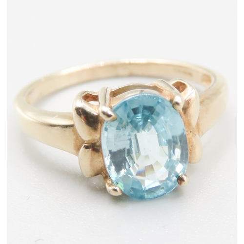 214 - Blue Topaz Single Stone Bow Motif Ring Mounted in 9 Carat Yellow Gold Ring Size O