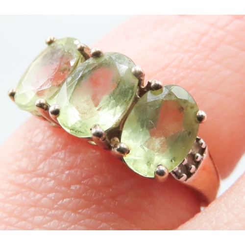 218 - Peridot Three Stone Ring Mounted in 9 Carat Yellow Gold Diamond inset to Shoulders Ring Size J and a... 