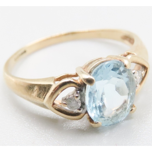 219 - Aquamarine Set Ring Mounted in 9 Carat Yellow Gold Diamond Inset to Shoulders Ring Size R