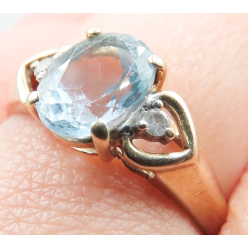 219 - Aquamarine Set Ring Mounted in 9 Carat Yellow Gold Diamond Inset to Shoulders Ring Size R