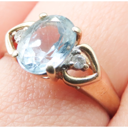 219 - Aquamarine Set Ring Mounted in 9 Carat Yellow Gold Diamond Inset to Shoulders Ring Size R