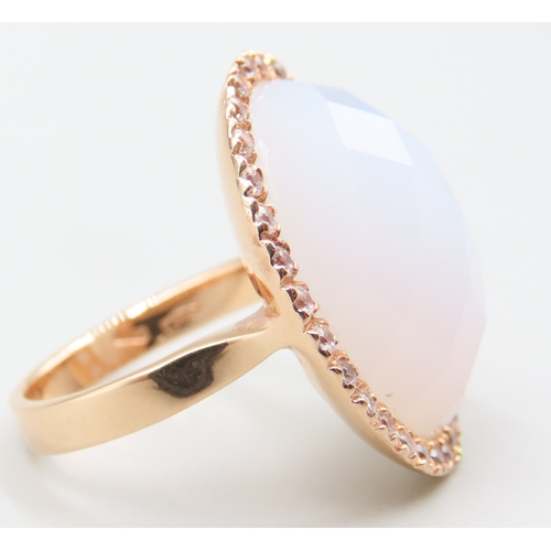 234 - Facet Cut Moonstone Ring with Gemstone Set Halo Mounted in 18 Carat Rose Gold Ring Size L and a Half
