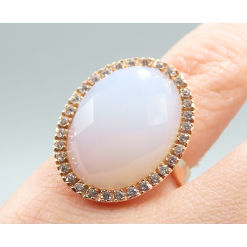 234 - Facet Cut Moonstone Ring with Gemstone Set Halo Mounted in 18 Carat Rose Gold Ring Size L and a Half