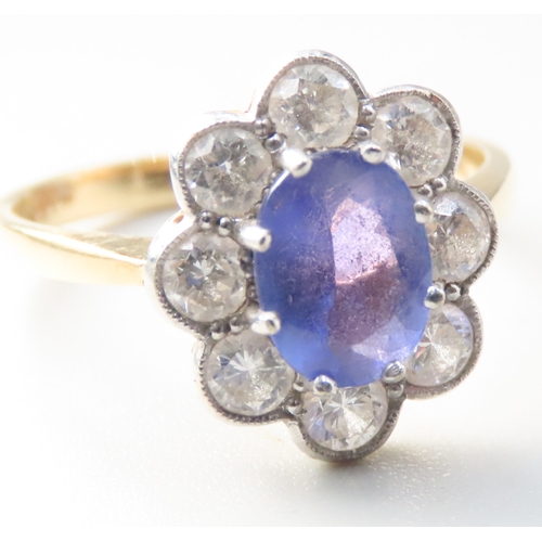 235 - Tanzanite AAA Centre Stone Ring with Eight Diamond Set Hallo Surround Mounted in 18 Carat Yellow Gol... 