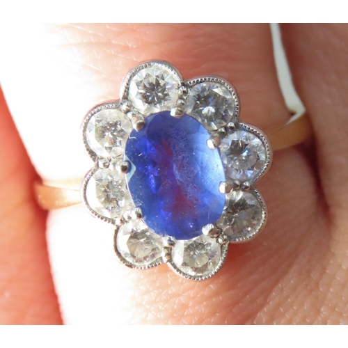 235 - Tanzanite AAA Centre Stone Ring with Eight Diamond Set Hallo Surround Mounted in 18 Carat Yellow Gol... 