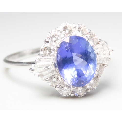 236 - Tanzanite AAA Centre Stone Ring with Round Cut and Tapered Baguette Cut Diamond Set Surround Mounted... 