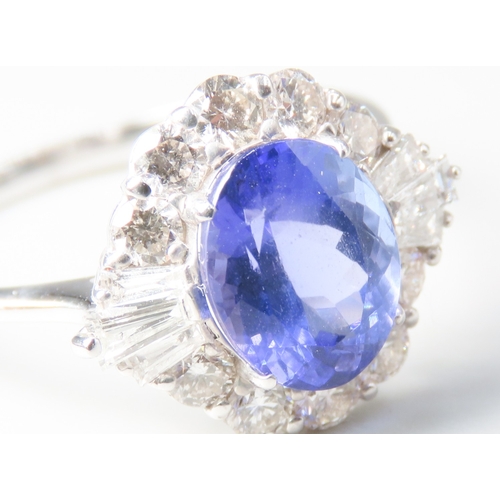 236 - Tanzanite AAA Centre Stone Ring with Round Cut and Tapered Baguette Cut Diamond Set Surround Mounted... 