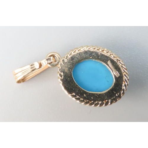 242 - Bezel Set Turquoise Set Single Stone Pendant Mounted in 9 Carat Yellow Gold 1.5cm High