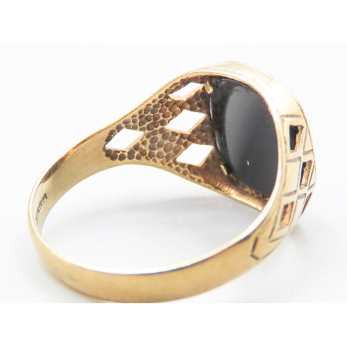 25 - Onyx Set Signet Ring Mounted in 9 Carat Yellow Gold Ring Size X