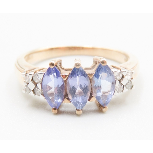 263 - Marquise Cut Tanzanite Three Stone Set Ring Mounted in 9 Carat Yellow Gold Further Diamonds Set to S... 