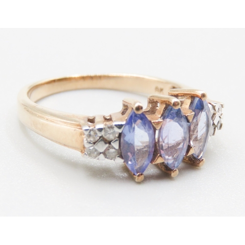 263 - Marquise Cut Tanzanite Three Stone Set Ring Mounted in 9 Carat Yellow Gold Further Diamonds Set to S... 