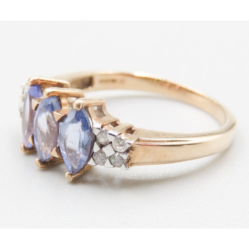 263 - Marquise Cut Tanzanite Three Stone Set Ring Mounted in 9 Carat Yellow Gold Further Diamonds Set to S... 