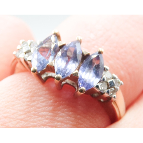 263 - Marquise Cut Tanzanite Three Stone Set Ring Mounted in 9 Carat Yellow Gold Further Diamonds Set to S... 