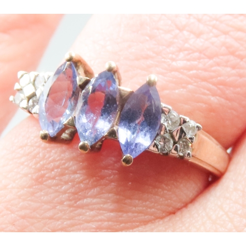 263 - Marquise Cut Tanzanite Three Stone Set Ring Mounted in 9 Carat Yellow Gold Further Diamonds Set to S... 