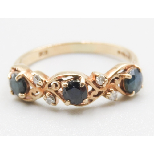 265 - Finely Detailed Sapphire Three Stone Ring with Diamond Insets Mounted in 9 Carat Yellow Gold Ring Si... 