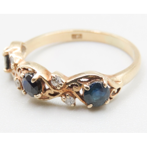 265 - Finely Detailed Sapphire Three Stone Ring with Diamond Insets Mounted in 9 Carat Yellow Gold Ring Si... 