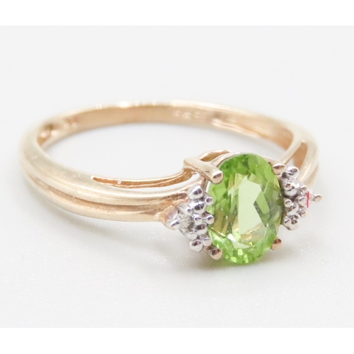 271 - Peridot Set Ring Mounted in 9 Carat Yellow Gold Diamond Inset to Shoulders Ring Size O and a Half