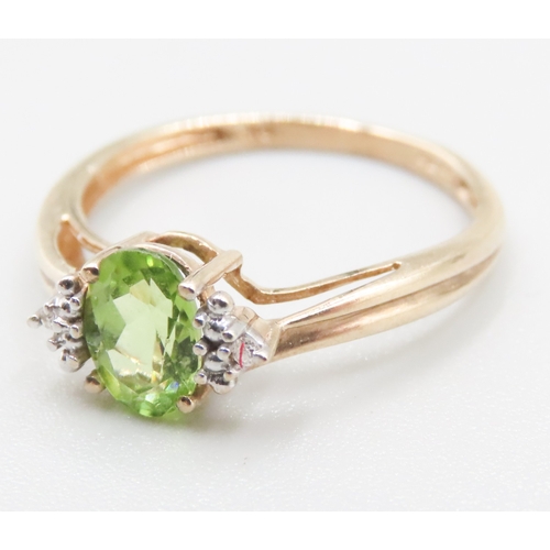 271 - Peridot Set Ring Mounted in 9 Carat Yellow Gold Diamond Inset to Shoulders Ring Size O and a Half